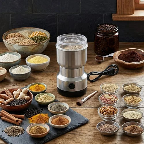 Original product gallery lifestyle photograph of the grinder surrounded by bowls of grains, beans, herbs and spices