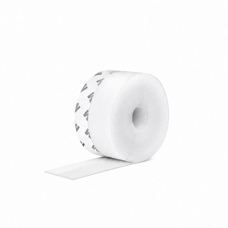 Actual transparent self-adhesive weather seal strip rolled up with clear flexible strip extending from the roll