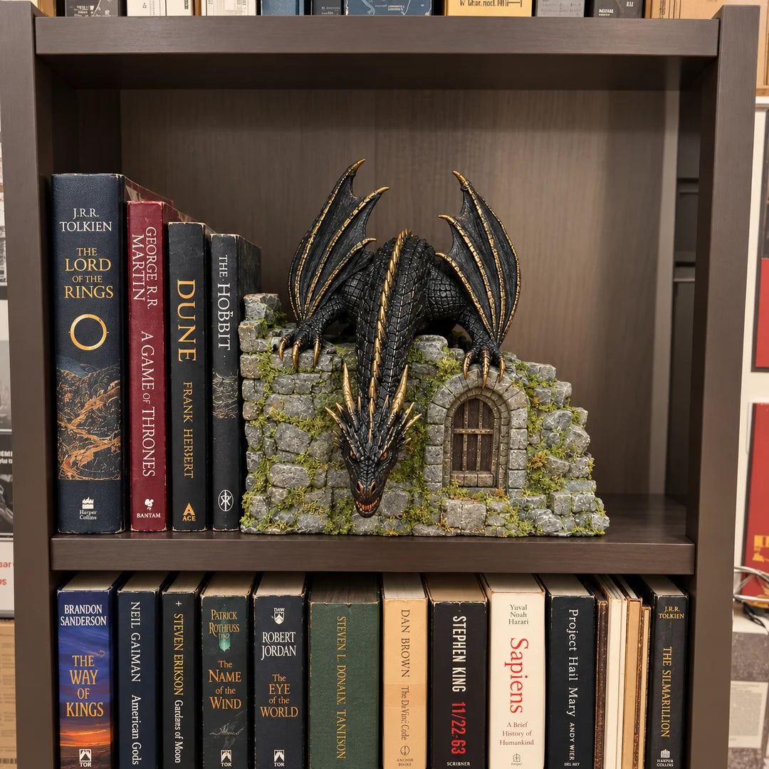 MistWyrm dragon and stone castle display placed between fantasy books on a wooden bookshelf