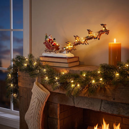 🎅 Lighted Santa Sleigh & Flying Reindeer Figurine – Warm LED Christmas Decor