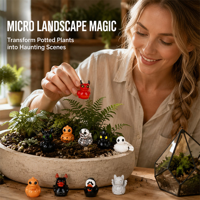 Miniature Halloween devil ducks in indoor plant micro landscape